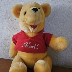 Vintage Winnie the poo with hinged arms and legs. 15 inches long.